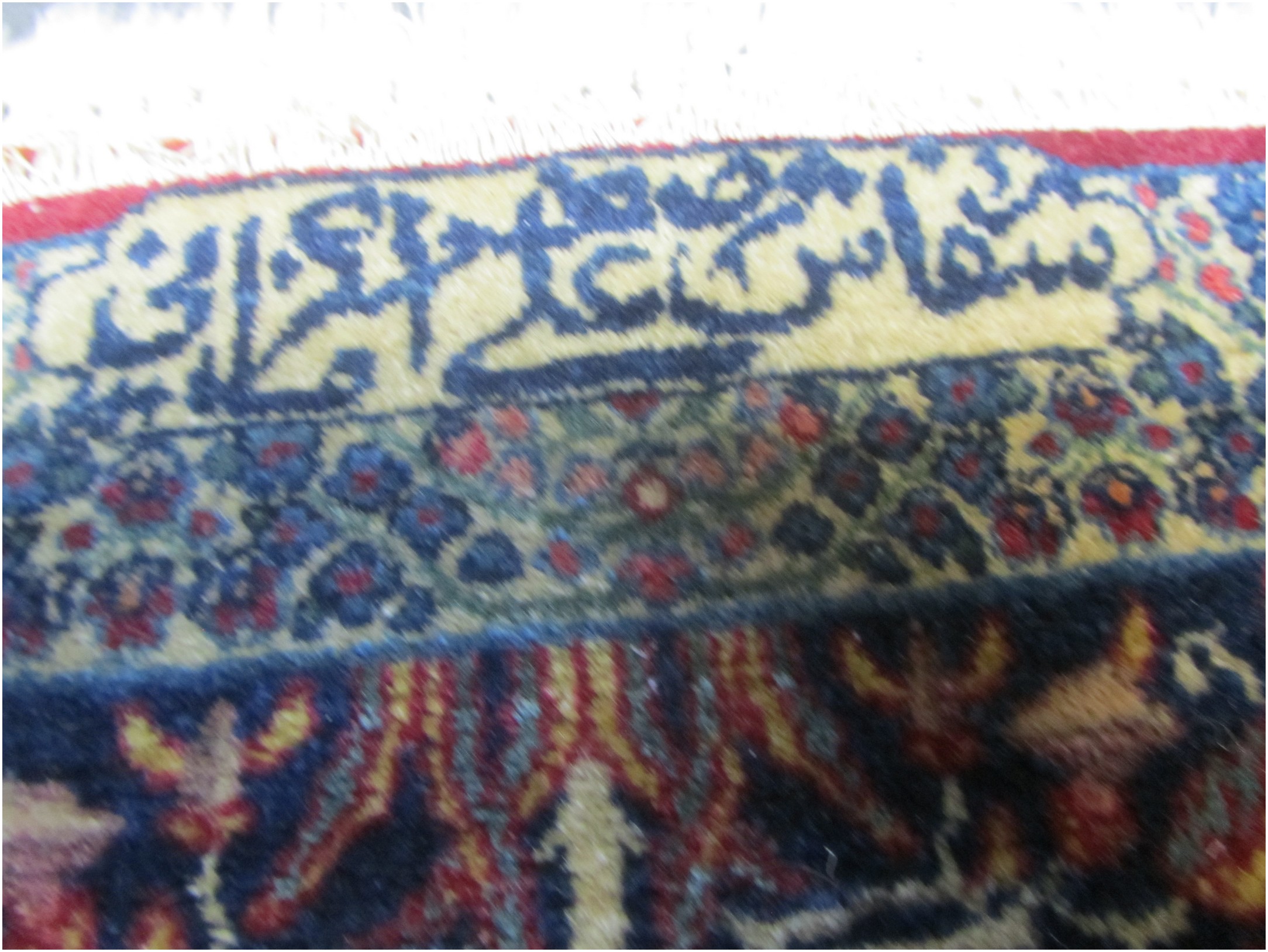 The second signature says COMMISSIONED BY ASGHAR ALI KERMANI